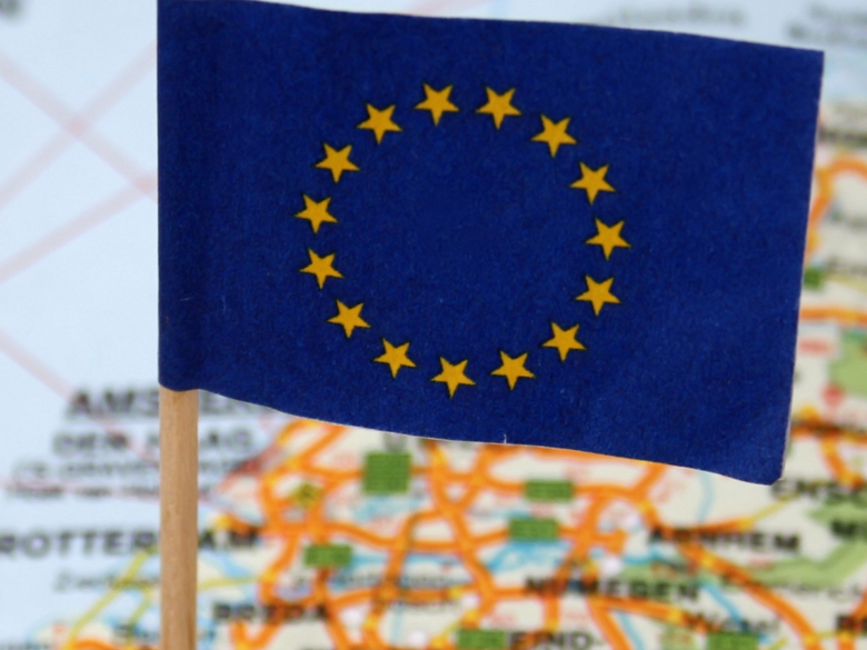 European flag in front of world map