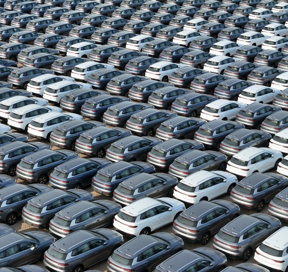 Many electric cars lined up in a row