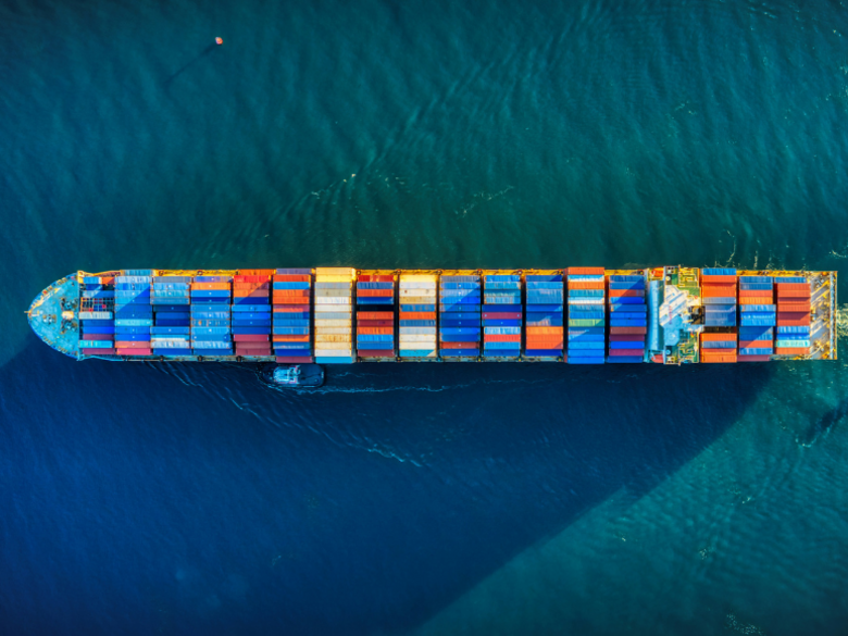A container ship photographed from above at sea