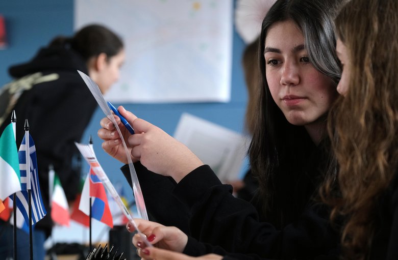 Colour photo: two teenagers playing the escape game.