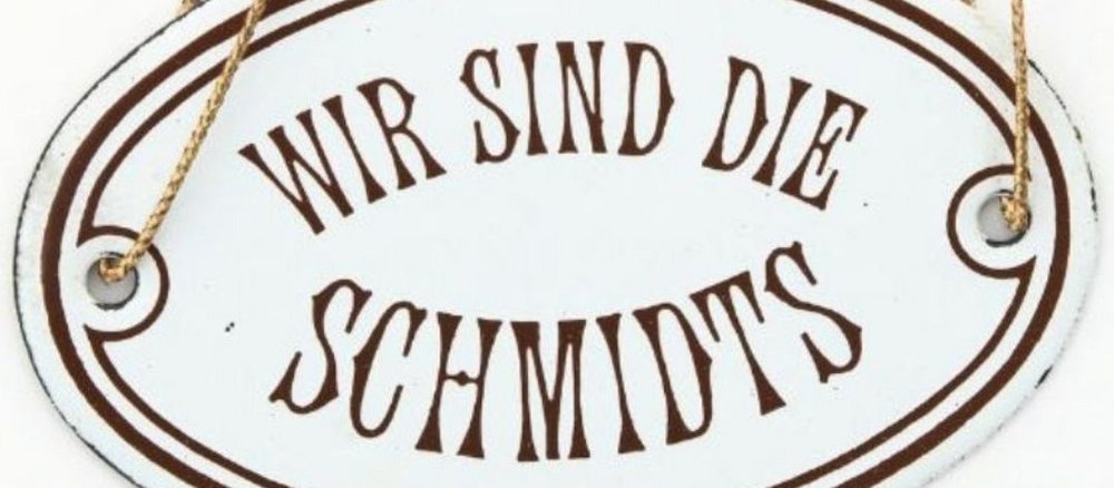 Haustürschild mit Inschrift Wir sind die Schmidts