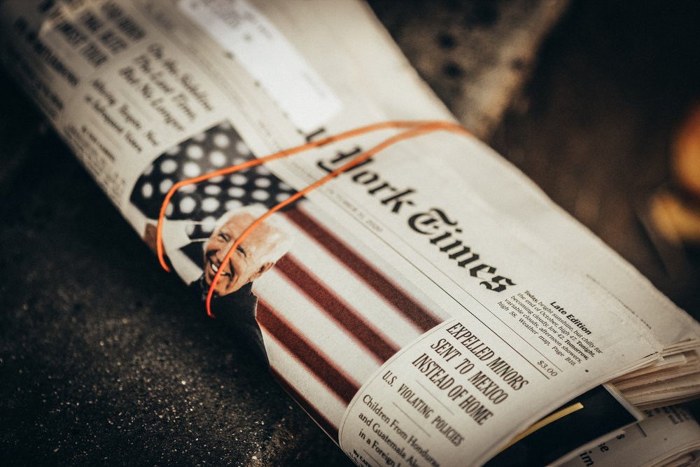 New York Times newspaper rolled up with Joe Biden on the cover