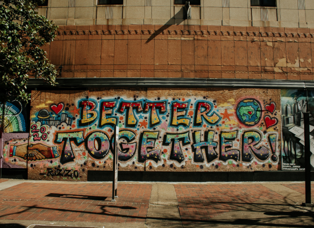 Colourful graffiti "Better Together" on a wall 