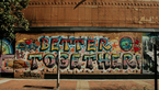 Colourful graffiti "Better Together" on a wall 
