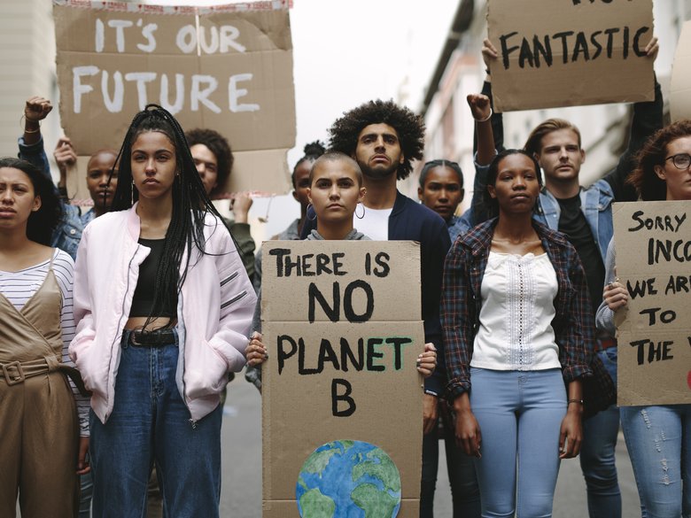 Group of activists from Fridays For Future with demonstration signs