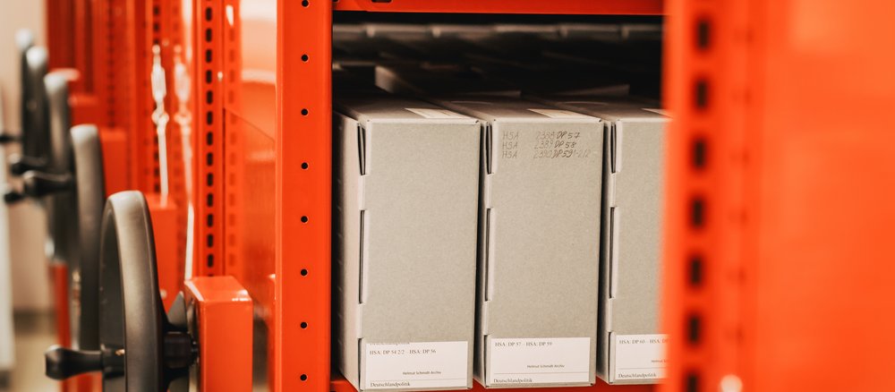 Colour photograph: red shelf with folders