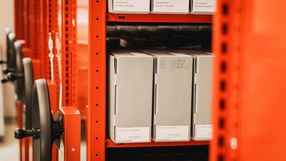 Colour photograph: red shelf with folders