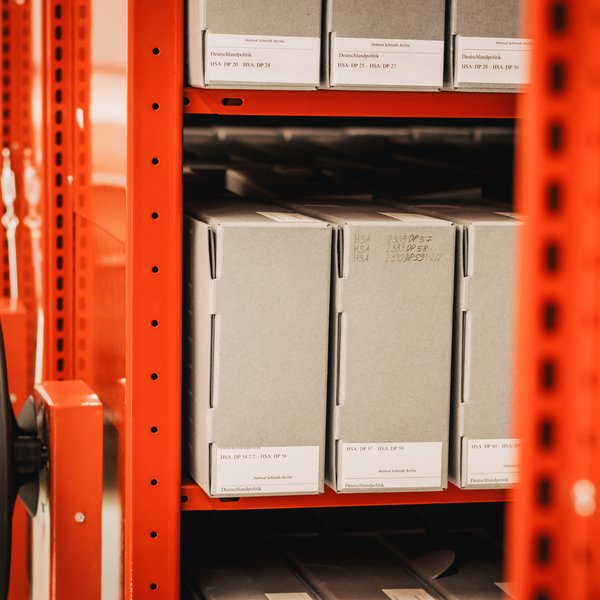 Colour photograph: red shelf with folders