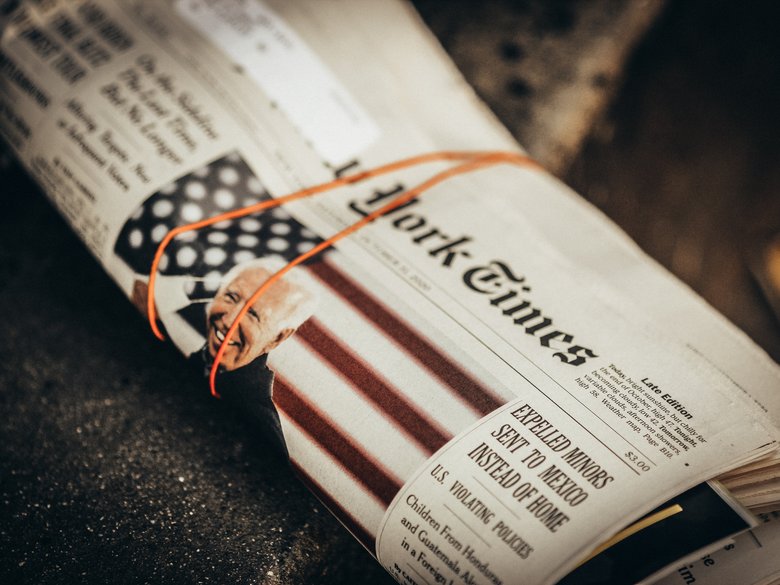 New York Times newspaper rolled up with Joe Biden on the cover