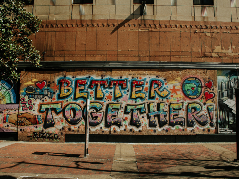 Colourful graffiti "Better Together" on a wall