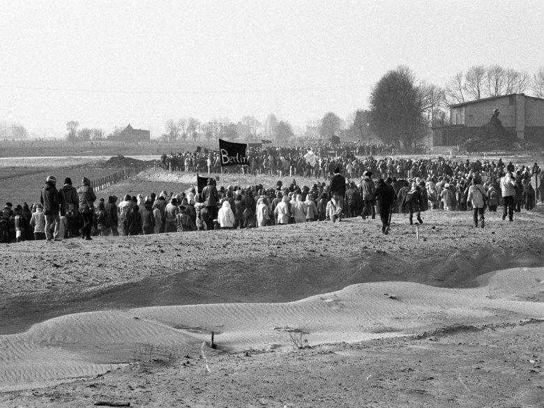 Black and white photo of long queue of demonstrators