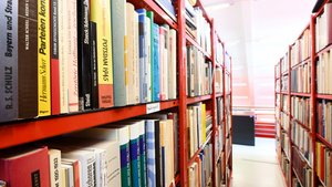 Row of red shelves with books