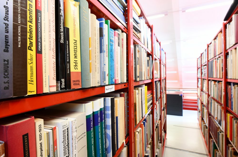 Row of red shelves with books