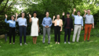Participants of the NextGen7 Summit in line and waving