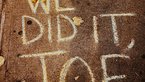 "WE DIT IT, JOE" written in chalk on the floor