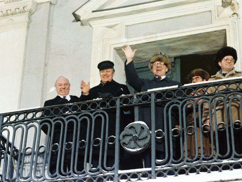 Chancellor Helmut Schmidt and Erich Honecker on the town hall balcony, waving.