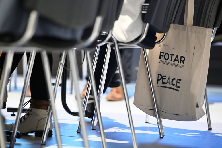 Colour photograph: chairs; a linen bag bearing the inscription ‘FOTAR’ is hanging from one of the chairs