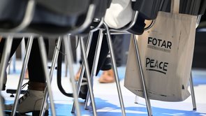 Colour photograph: chairs; a linen bag bearing the inscription ‘FOTAR’ is hanging from one of the chairs