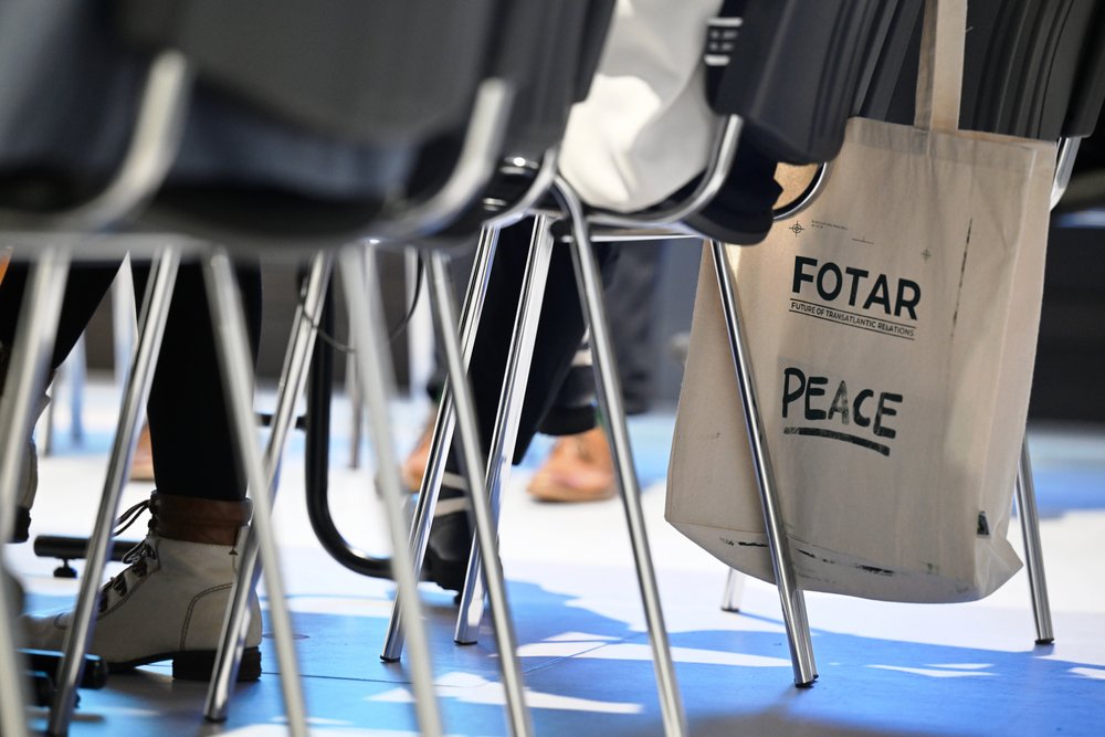  Colour photograph: chairs; a linen bag bearing the inscription ‘FOTAR’ is hanging from one of the chairs