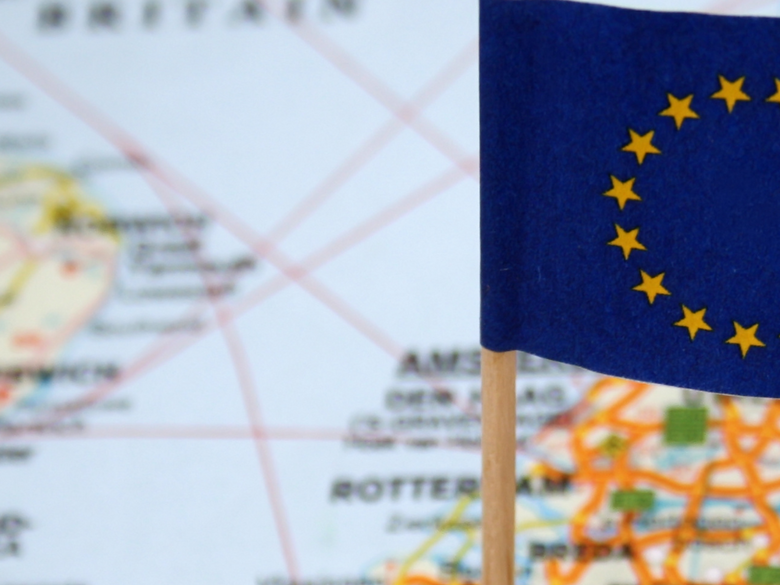 European flag in front of world map