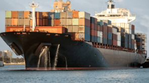 Container ship with colourful containers on water