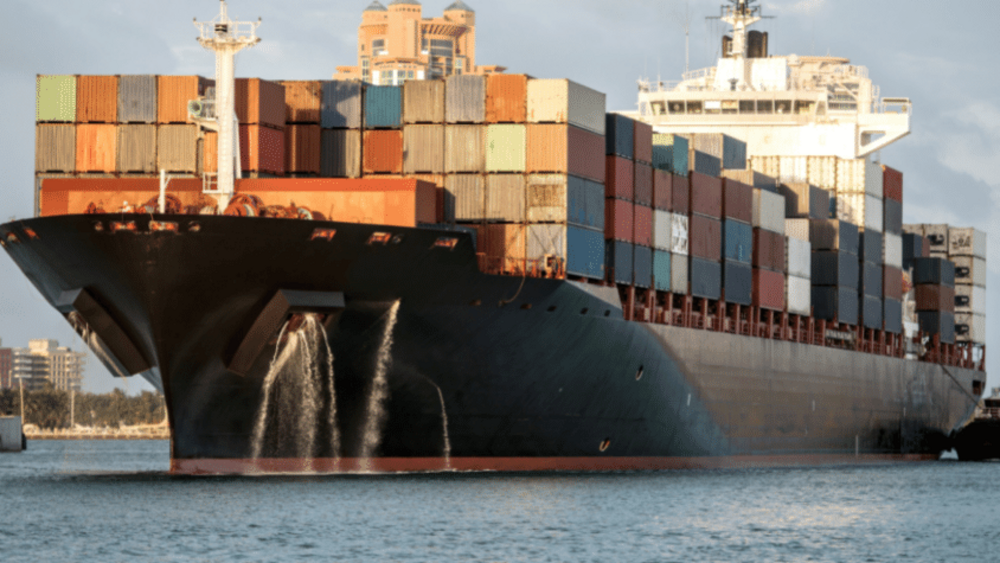 Container ship with colourful containers on water
