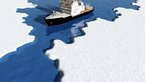 Ship at sea between ice floes