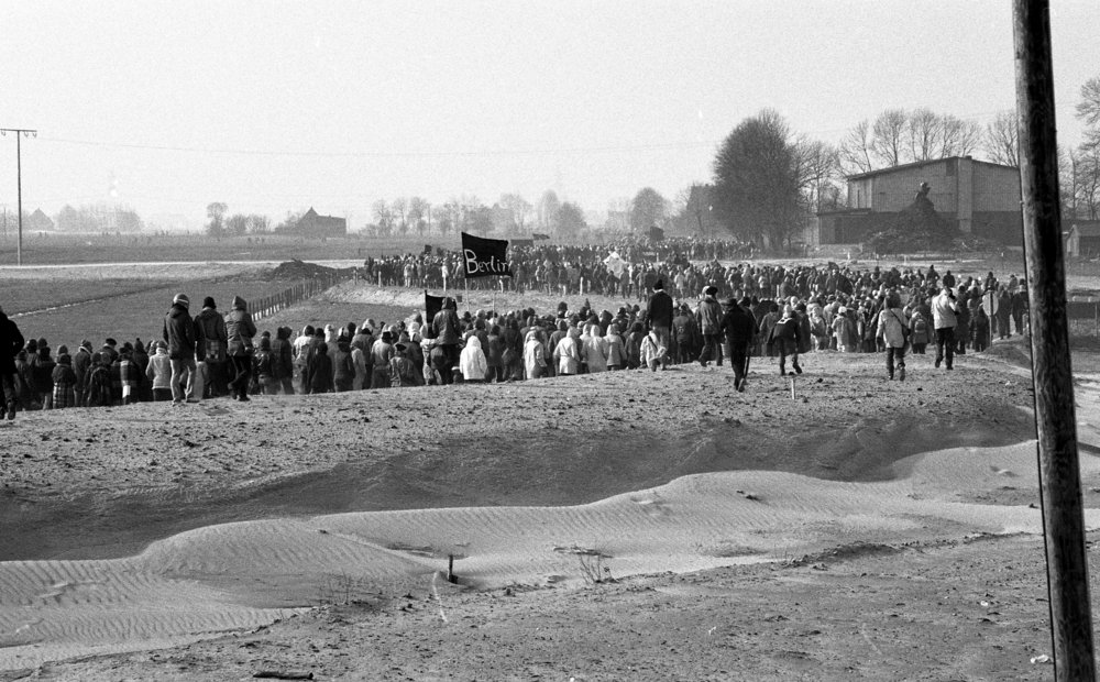 Black and white photo of long queue of demonstrators