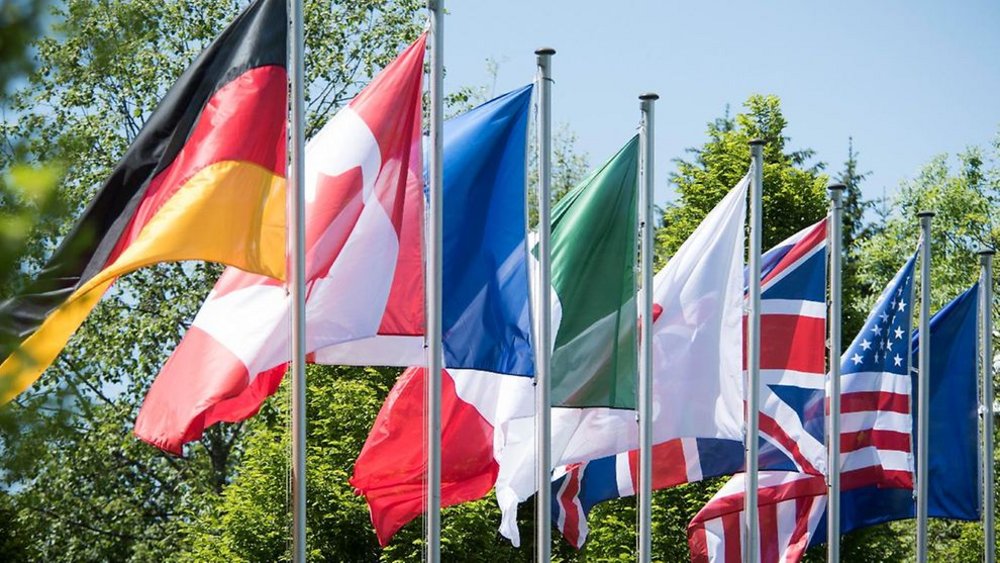 The G7 flags on the flagpole